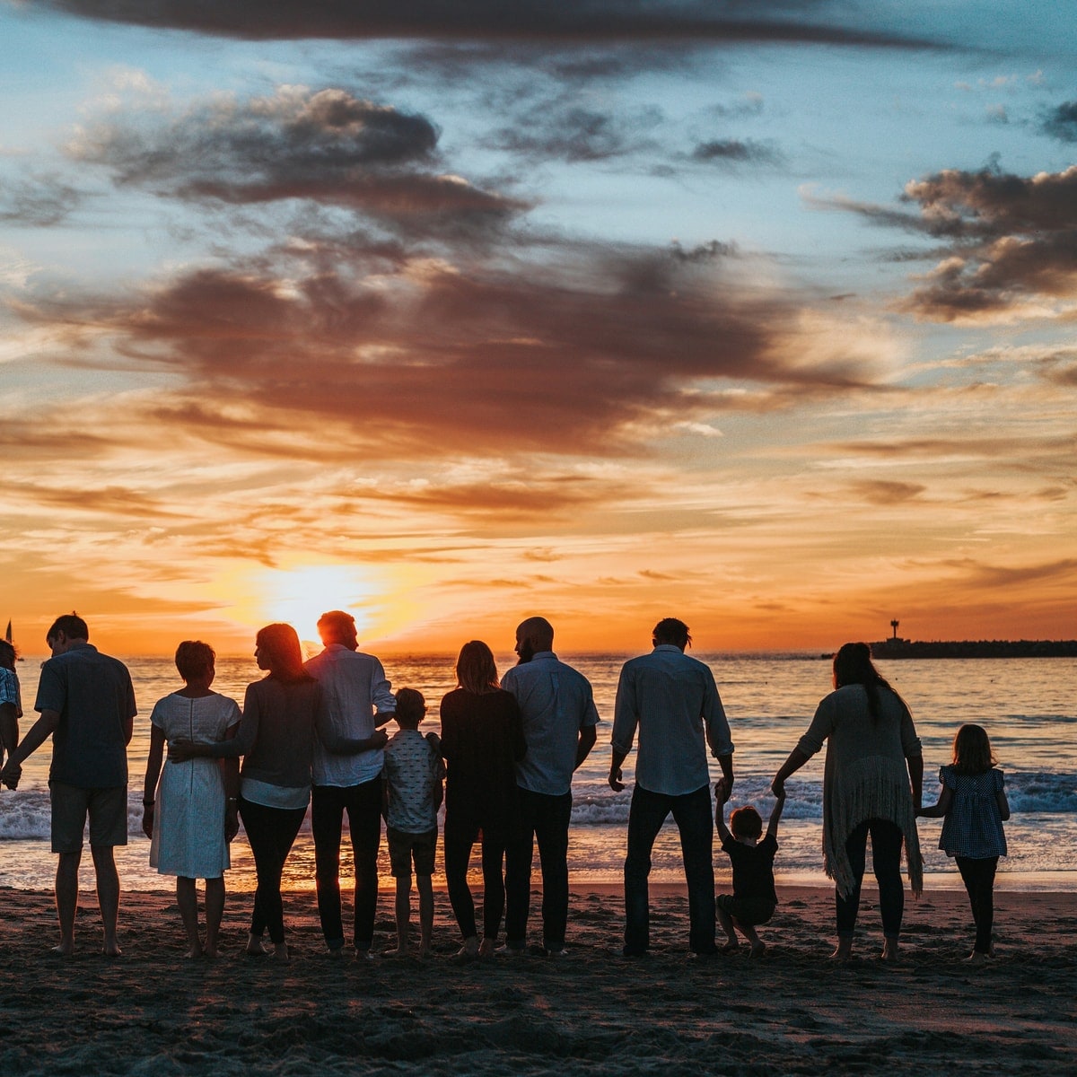 Family walking together while planning a summer camp trip